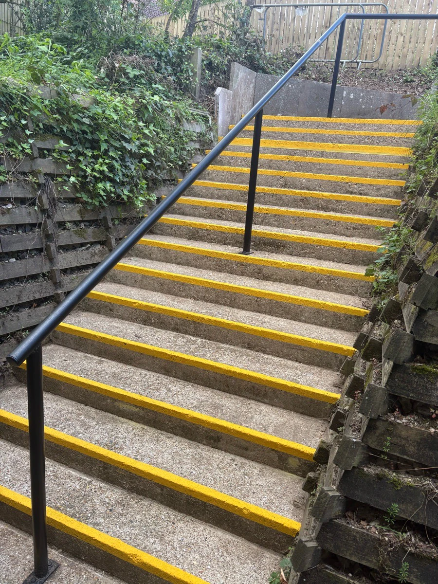 Steps with new handrails and high-visibility stair nosings